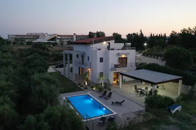 an aerial view of a house with a swimming pool at La Luna Villa in Rhodes Town