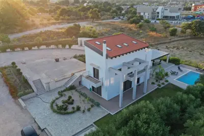 an aerial view of a house with a swimming pool at La Luna Villa in Rhodes Town