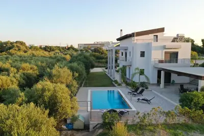 a view of a house with a swimming pool at La Luna Villa in Rhodes Town