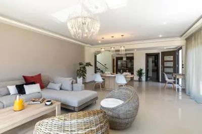 a living room with a couch and a table at La Luna Villa in Rhodes Town