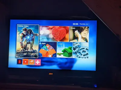 a television screen with a bunch of pictures on it at Rosalia Apartments in Halki