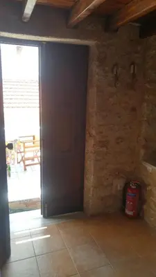 an open door in a room with a patio at Rosalia Apartments in Halki
