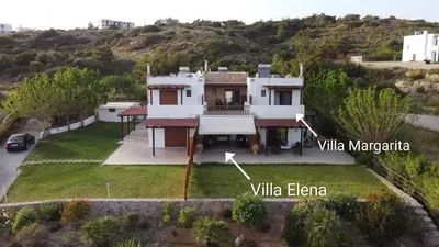 an aerial view of a villa in the hills at Blue Harmony Villas in Kiotari