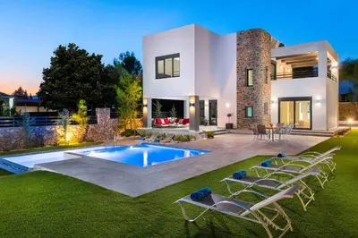 a house with a swimming pool in the yard at Villa Summer Light in Kiotari
