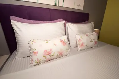 a group of pillows sitting on a bed at Lila Studio in Kalathos