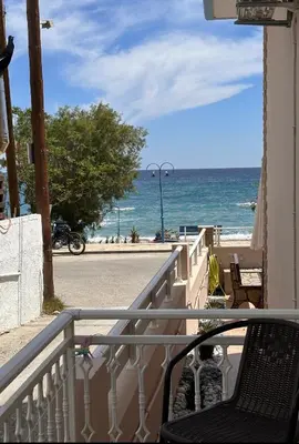 a balcony with a view of the ocean at Stegna Sea & Sun in Archangelos