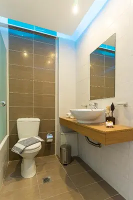 a bathroom with a toilet and a sink at City Center Hotel in Rhodes Town