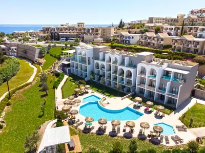 an aerial view of a resort with a swimming pool at Lindos Breeze Beach Hotel in Kiotari