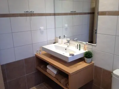 a bathroom with a sink and a mirror at Villa Anna in Pefki Rhodes
