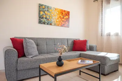 a living room with a couch and a table at Costa Gennadi Villa in Gennadi