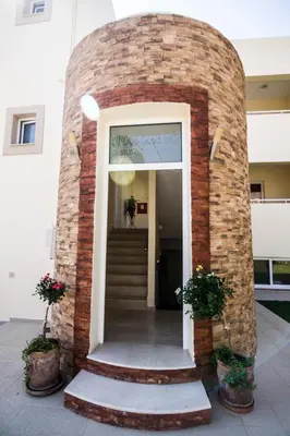 a brick entry way to a building at Lindos Blue Sky in Líndos