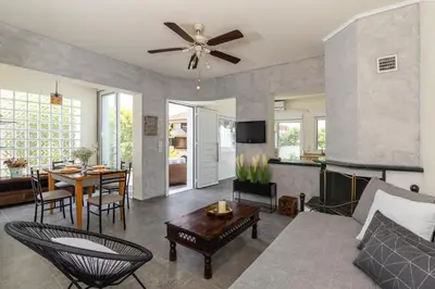 a living room with a couch and a table at ELENA HOUSE 2 in Gennadi