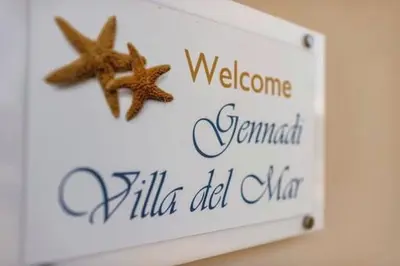 two starfish on a welcome sign for a hotel at Gennadi Villa Del Mar in Gennadi