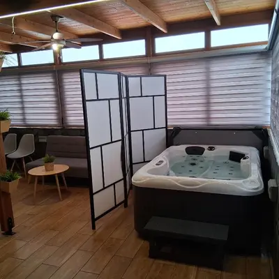 a jacuzzi tub in a room with a ceiling at Sioutis House in Soroni