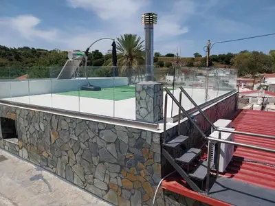 a building with a golf course on top of it at Sioutis House in Soroni