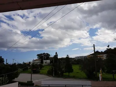 a view from a window of a street at Theti Apartment in Faliraki