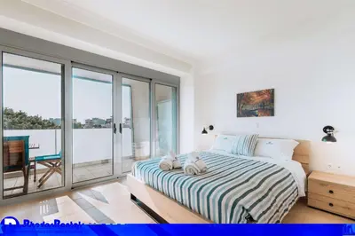 a bedroom with a bed with two stuffed animals on it at Rhodes Port Haven Suite in Rhodes Town