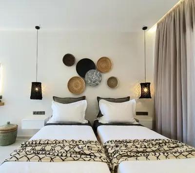 two beds sitting next to each other in a bedroom at St.Thomas Beach Luxury Apartments in Pefki Rhodes