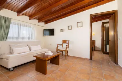 a living room with a couch and a table at Villas Duc - Rhodes in Ialyssos