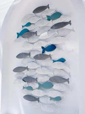a group of fish in a row on a shelf at KALITHEA-HILLS APARTMENT 3 in Koskinou