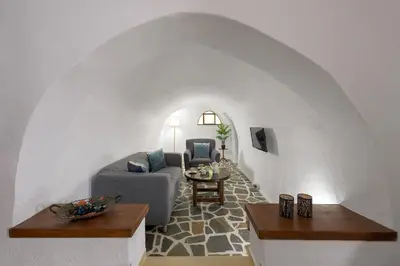a living room with a couch and a table at RUSTIC SELF-INN in Rhodes Town