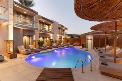 a swimming pool in the middle of a resort at Oasis Hotel Prasonisi in Prasonisi