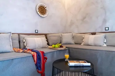 a living room with a couch and a table at Oasis Hotel Prasonisi in Prasonisi