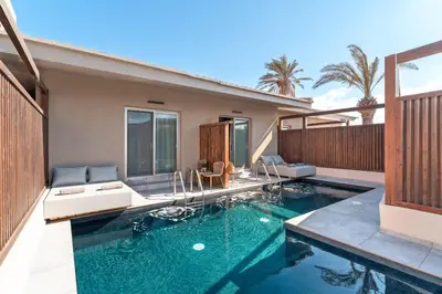 a swimming pool in a house at Oasis Hotel Prasonisi in Prasonisi