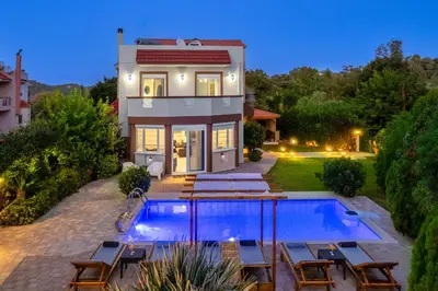 a house with a swimming pool in the backyard at EvMar Villa in Rhodes Town
