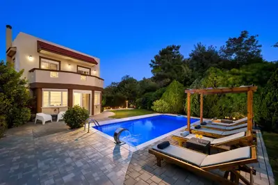 a home with a swimming pool and a house at EvMar Villa in Rhodes Town