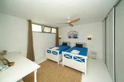 a bedroom with two beds and a ceiling fan at KALITHEA-HILLS VILLA with pool for 8 up to 12 IN RHODES TOWN in Rhodes Town