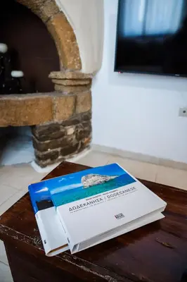 a book sitting on top of a table at Anesis Traditional Rhodian House in Kattavía