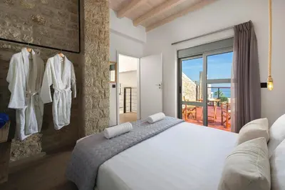 a bedroom with a white bed and a window at Luxury villa in Lachania near sea in Lachania
