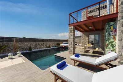 a villa with a swimming pool and a patio at Luxury villa in Lachania near sea in Lachania