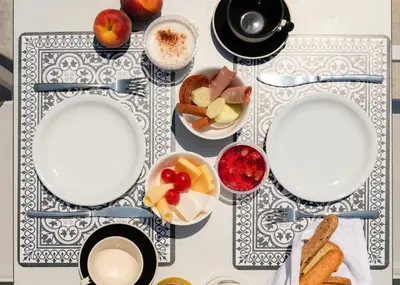 a table topped with plates and bowls of food at Nama Retreat in Pastida