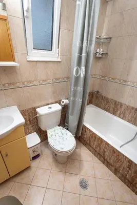 a bathroom with a toilet and a tub and a shower at Villa Chelidonia Afantou in Afantou