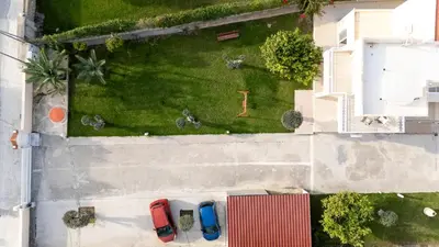 an overhead view of cars parked in a parking lot at Villa Chelidonia Afantou in Afantou