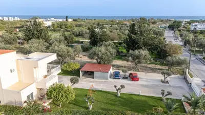 an aerial view of a house with a parking lot at Villa Chelidonia Afantou in Afantou