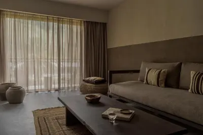 a living room with a couch and a coffee table at Cook's Club Kolymbia Rhodes -Adults only in Kolimbia