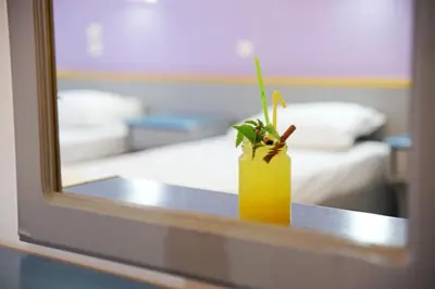 a vase with a plant on a table in a room at Falirala Central in Faliraki
