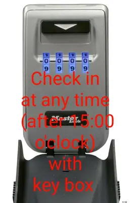 a check in machine with the words check in at any with lock at green - comfy center rodos in Asgourou