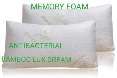 a white pillow with the words memory foam antibacterial bamboo lux dream at green - comfy center rodos in Asgourou