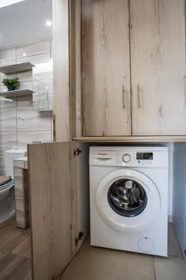 a white washer and dryer in a kitchen at Sunny Villa in Faliraki