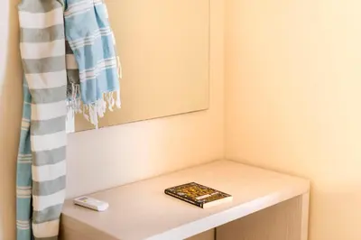 a book sitting on top of a table in a room at Lefka Hotel & Apartments in Rhodes Town