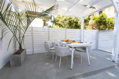 a white table and chairs on a patio at 30villa Rd Studio in Rhodes Town
