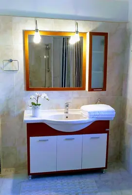 a bathroom with a sink and a mirror at Villa Dalia in Archangelos