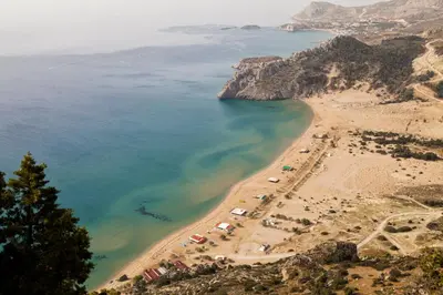 an aerial view of a beach with umbrellas at Rose traditional house in Archangelos
