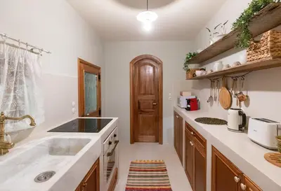 a kitchen with a sink and a counter at Rose traditional house in Archangelos