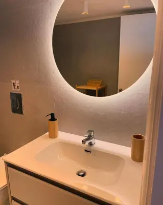 a bathroom sink with a large mirror above it at Villa Hiona-Seafront Villa in Halki
