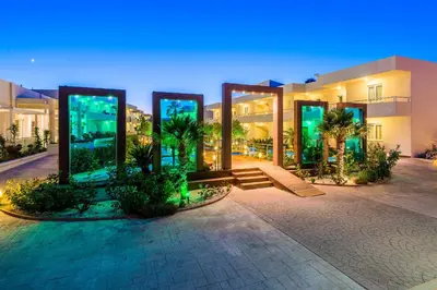a large building with a lot of glass at Afandou Bay Resort Suites in Afantou